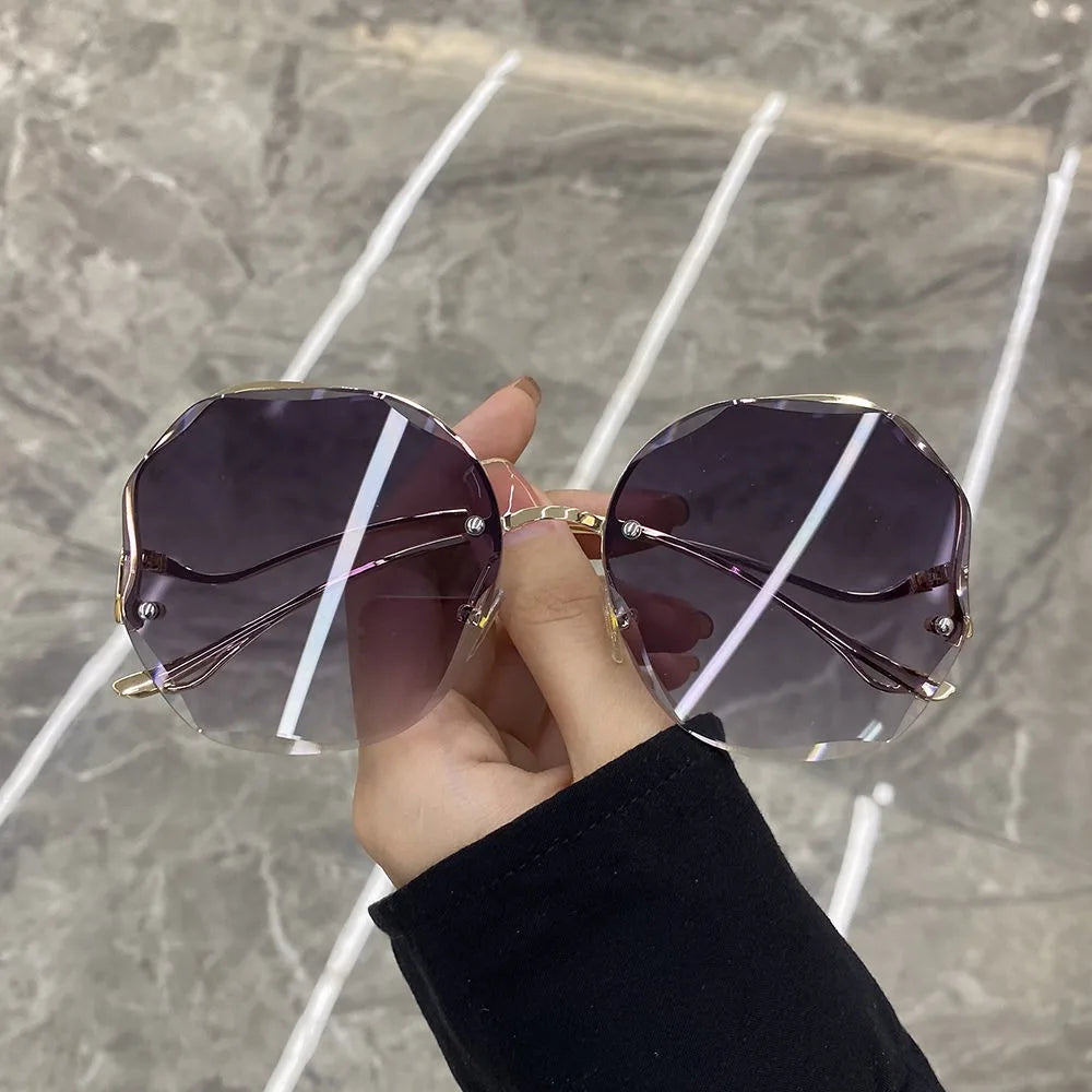 Trendy fashionable polygonal frameless cut edge sunglasses women's metal curved legs retro street photo sunglasses