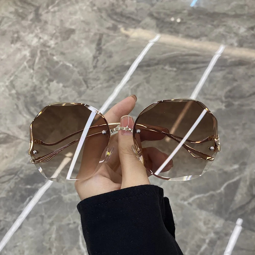 Trendy fashionable polygonal frameless cut edge sunglasses women's metal curved legs retro street photo sunglasses