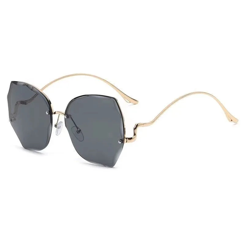 Trendy fashionable polygonal frameless cut edge sunglasses women's metal curved legs retro street photo sunglasses