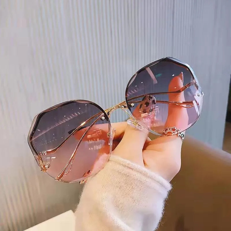Trendy fashionable polygonal frameless cut edge sunglasses women's metal curved legs retro street photo sunglasses
